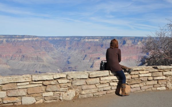 woman enjoying view Grand Canyon | ROAD TRIP: Tucson to Grand Canyon Railway